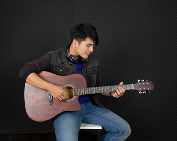 Portrait of a man playing guitar