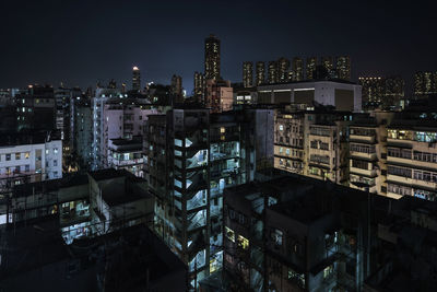 Buildings in city at night