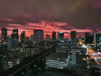 High angle view of illuminated buildings against sky at sunset