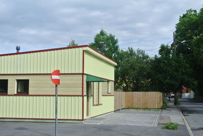 Street by building against sky