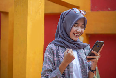 Young woman using mobile phone