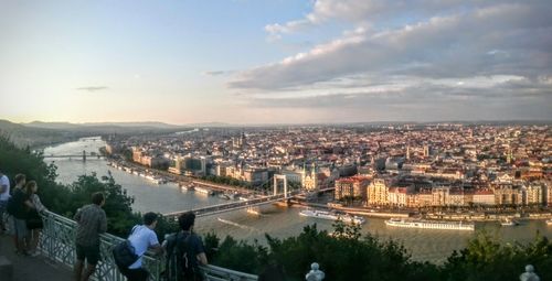 Cityscape against cloudy sky