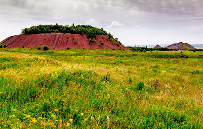 View of landscape against cloudy sky