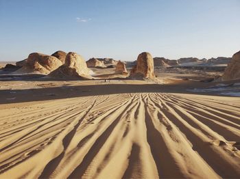 Rock formations in desert against sky