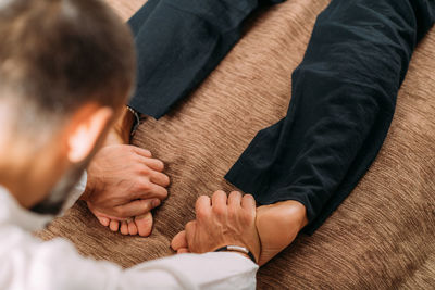 Shiatsu foot massage. therapist massaging the kidney meridian.