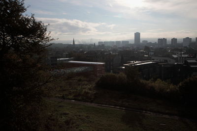 High angle view of trees and buildings against sky