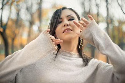 Portrait of young woman looking away