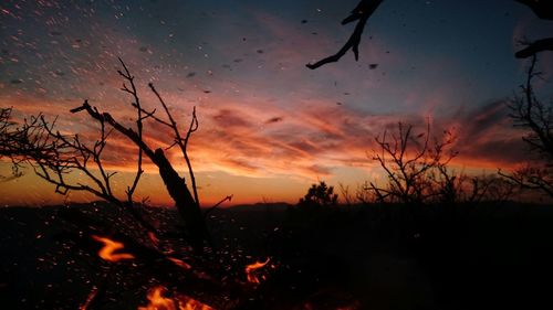 Scenic view of dramatic sky at sunset