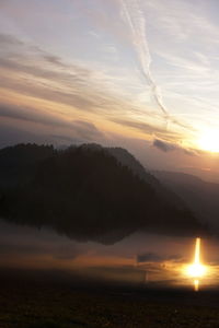 Scenic view of sunset over lake