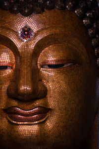 Close-up of buddha statue in temple