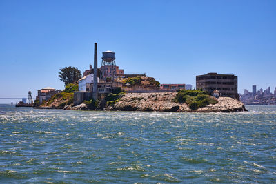 Scenic view of sea against clear blue sky