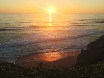 Scenic view of sea against clear sky during sunset