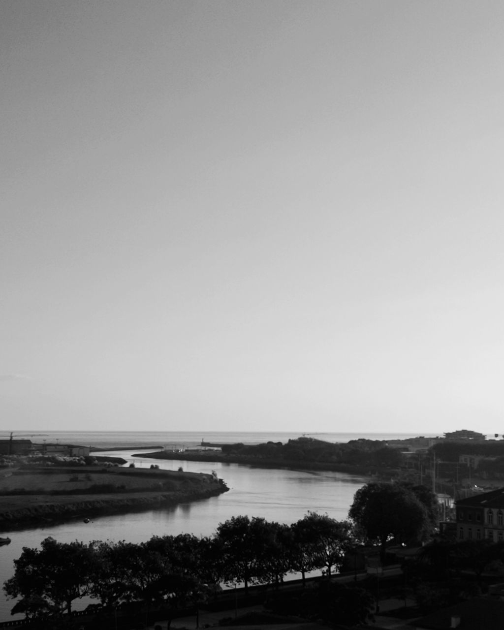 VIEW OF RIVER AGAINST CLEAR SKY