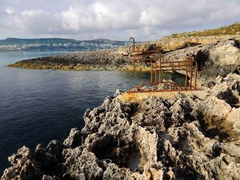 Scenic view of sea against cloudy sky