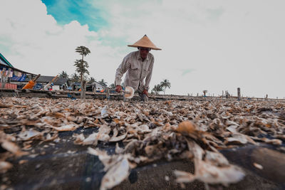 Low angle view of man on beach against sky