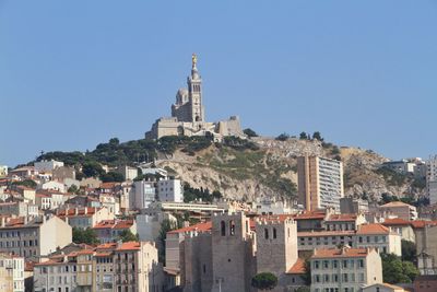 Low angle view of notre dame de la garde against clear sky