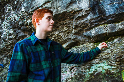 High angle view of baby boy on rock