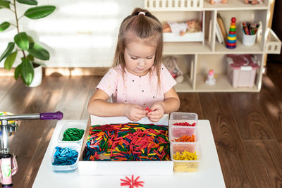 High angle view of cute girl painting