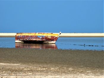 A solitary boat on the beach at dhanuskodi, tamil nadu, india.