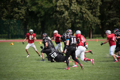 Group of people playing on grassland