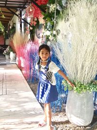 Portrait of smiling girl standing outdoors