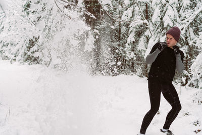 Man kicking on snow