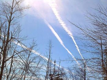 Low angle view of vapor trails in sky