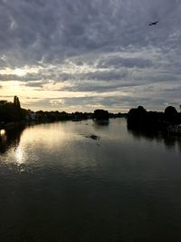 Scenic view of lake against sky during sunset