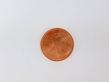 Close-up of coin against white background