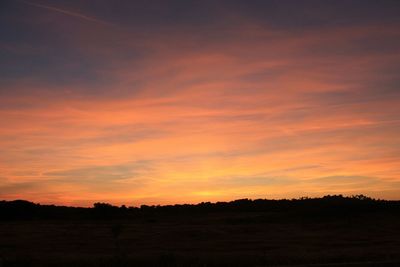 Scenic view of landscape at sunset