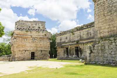 Old ruins of temple against cloudy sky