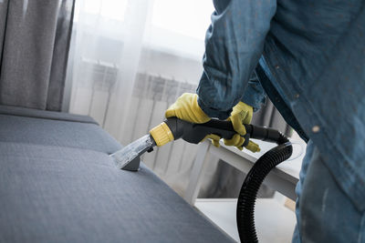 Low section of man working at workshop