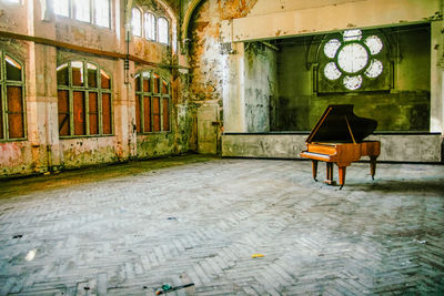 Empty chair in abandoned room