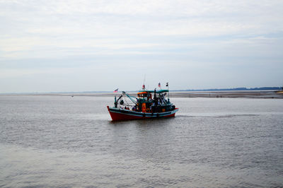 Boat on sea against sky