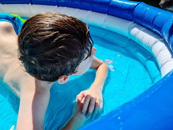 Boy swimming in pool