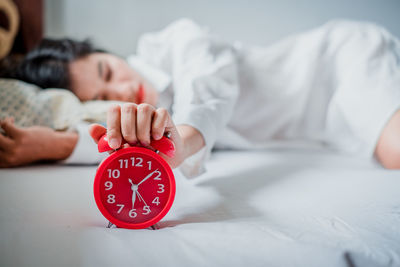 Woman sleeping on bed at home