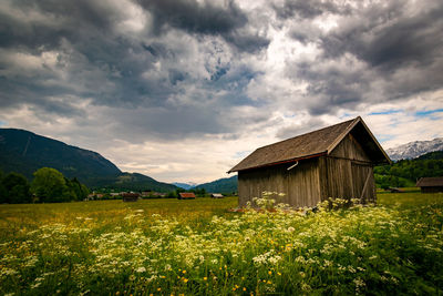 House on field against sky