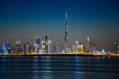 Illuminated city buildings at night