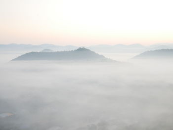 Scenic view of mountains against sky during sunset