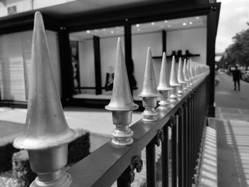 Close-up of chess by railing against building