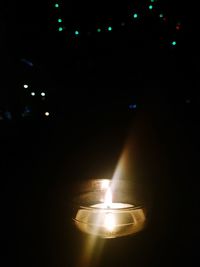 Illuminated lamp post at night