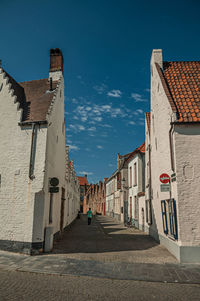 Brick facade of old houses in an empty street of bruges. a town full of canals in belgium.