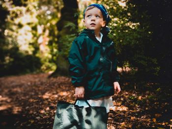 Full length of boy in forest