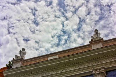 Low angle view of statue against sky