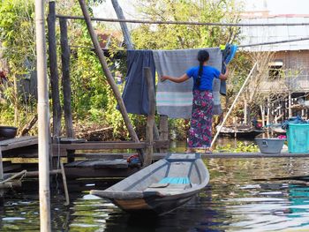 Man working in boat at canal