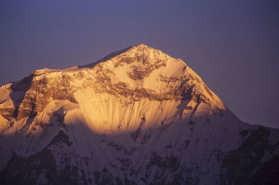 Scenic view of mountains against clear sky during winter