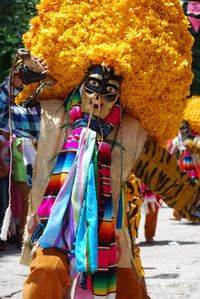 Person in costume on road in city during carnival