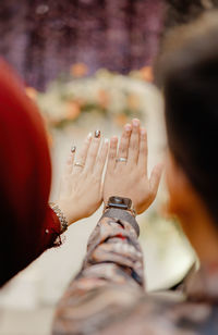 Low section of woman holding hands