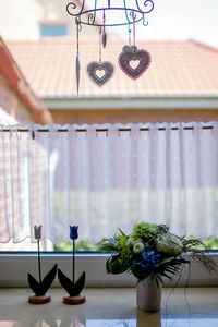 Potted plant on table against window