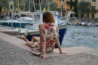 Rear view of woman on shore